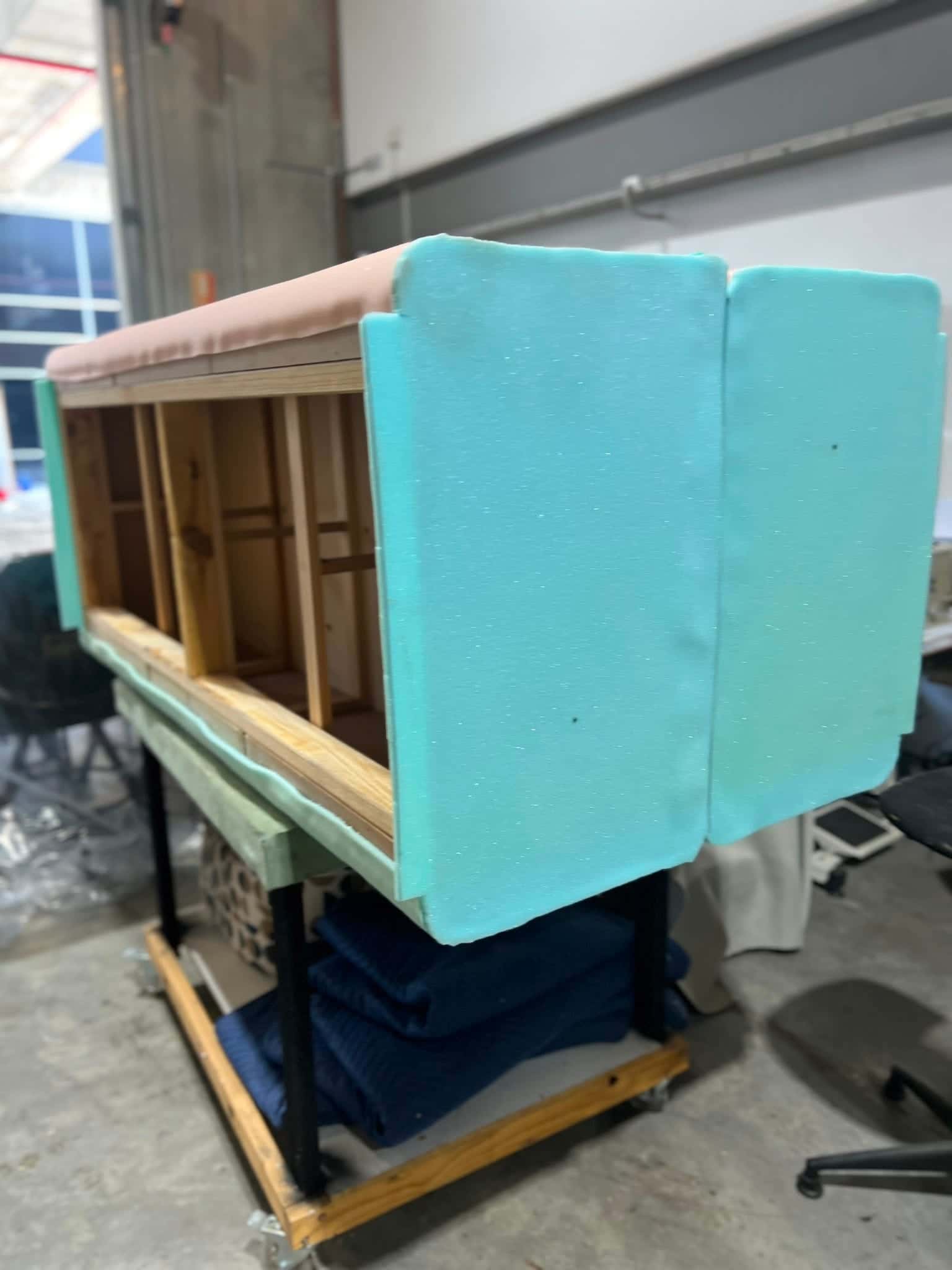 A banquette frame foamed up and ready for its cover