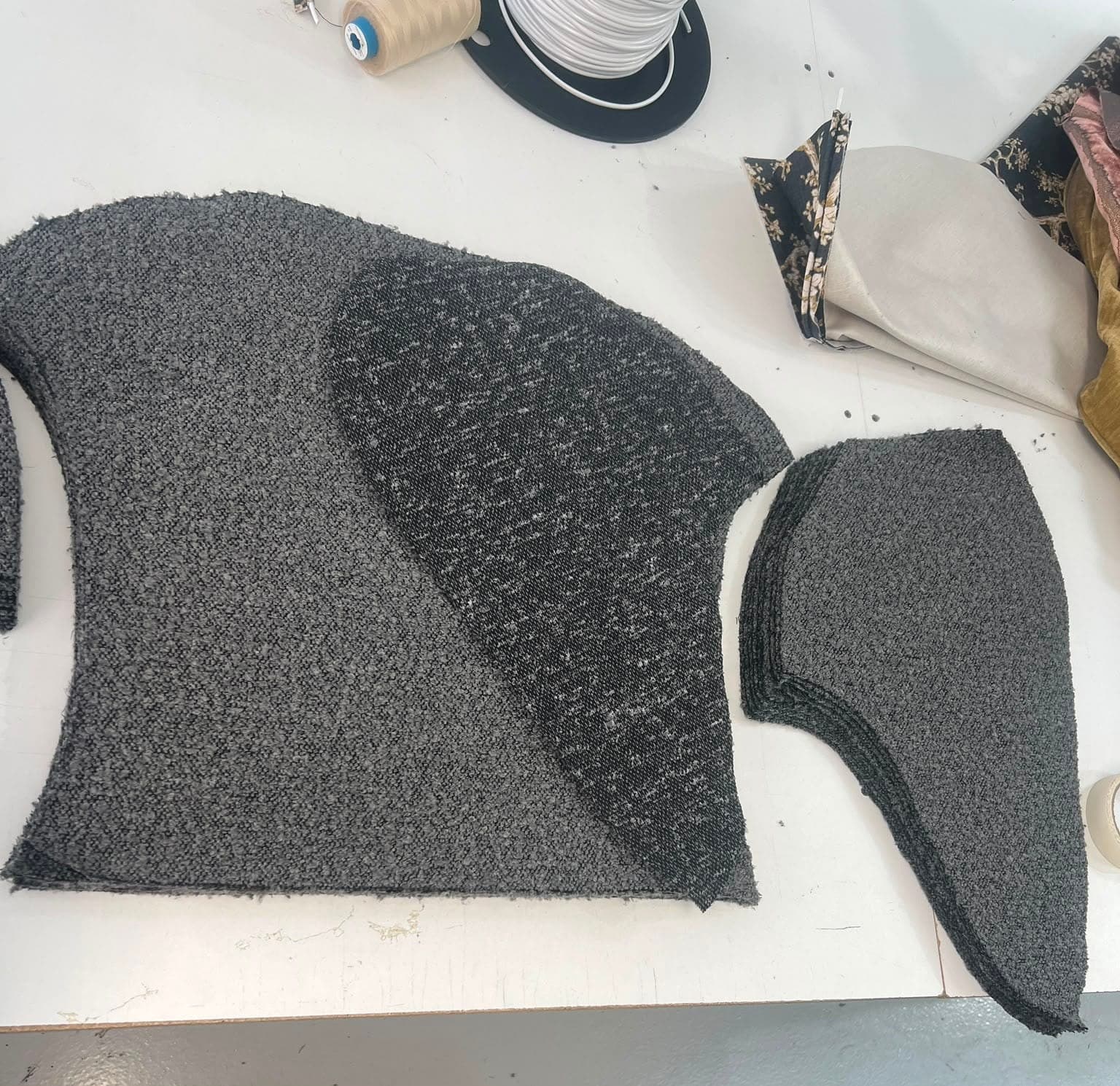 Bouclé panels laid out on the cutting table