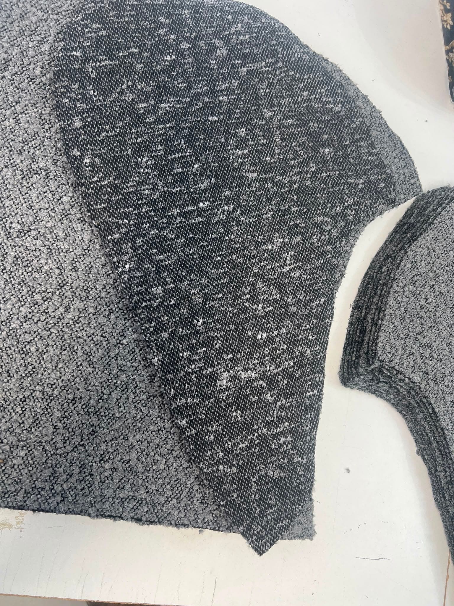 Bouclé cover panels cut and matched on the bench