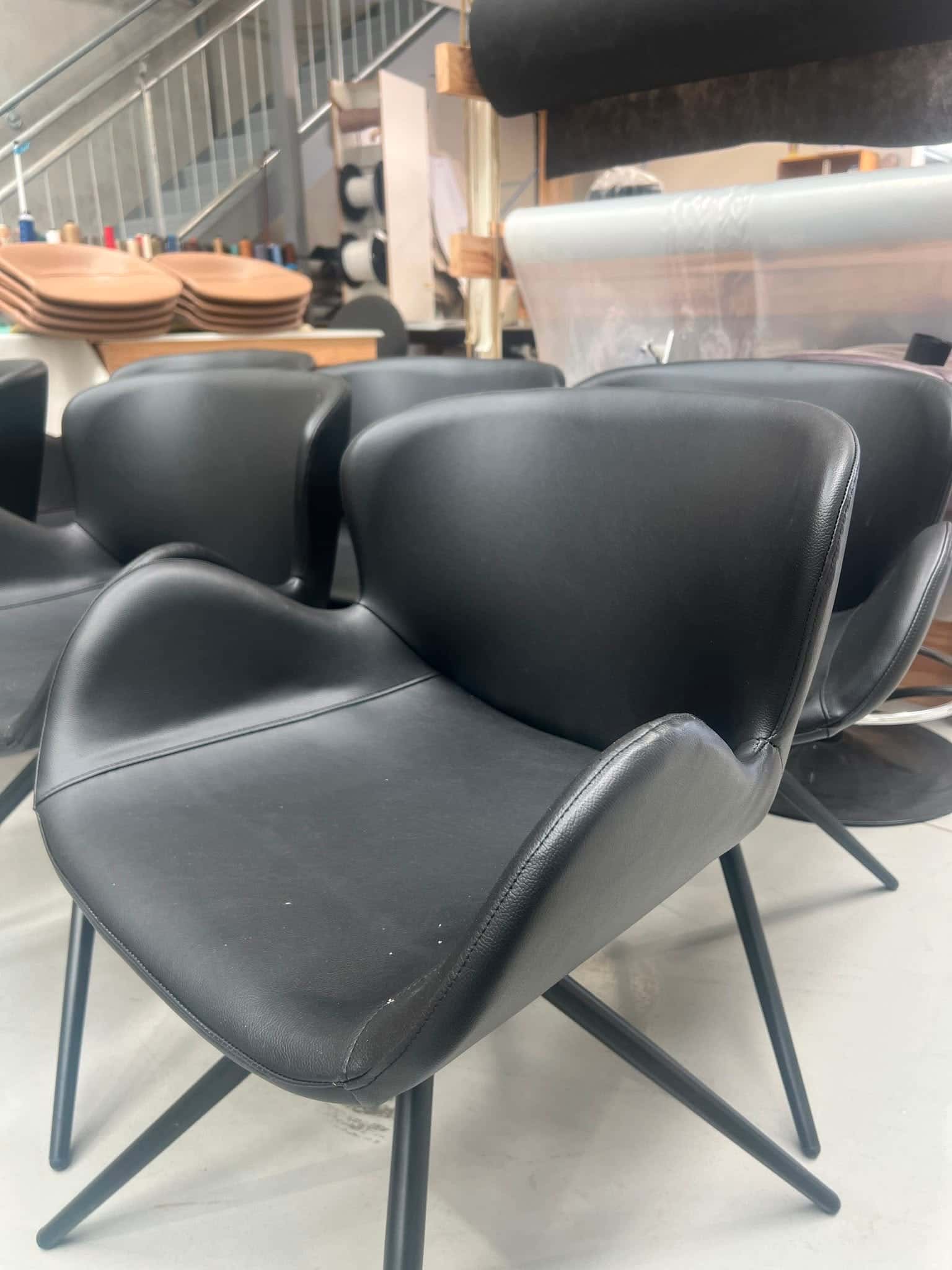 Dining chairs finished in black leather