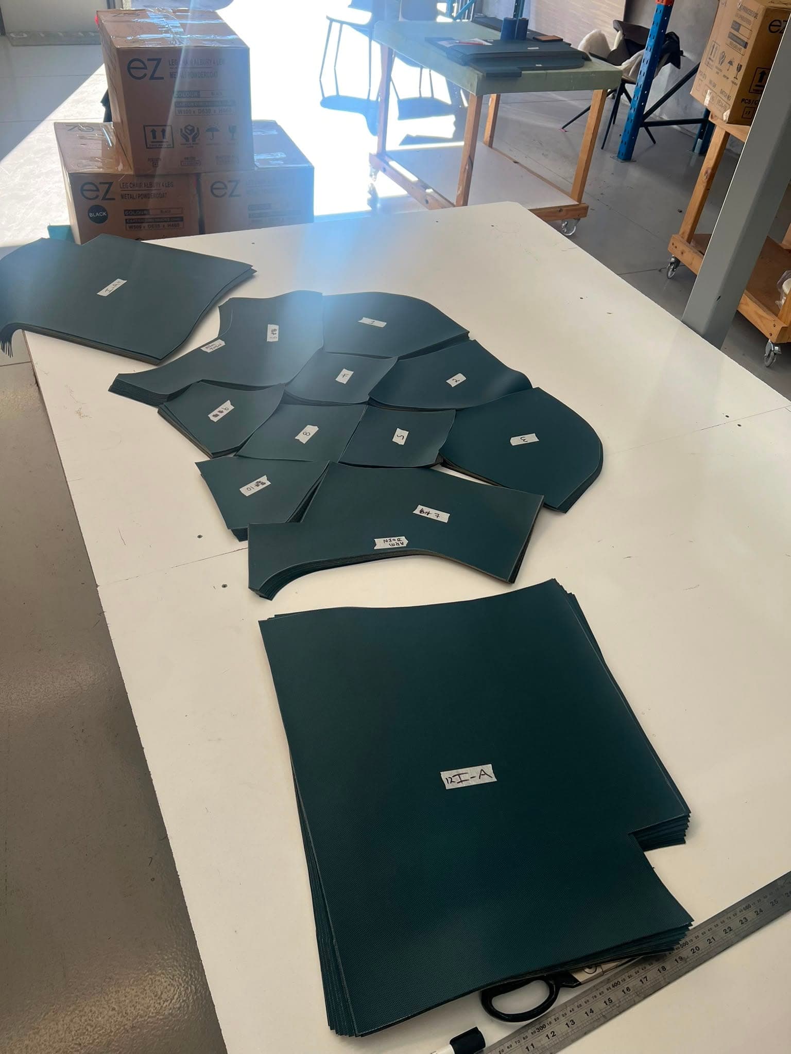 Cover panels cut, bundled and labelled from a client's templates