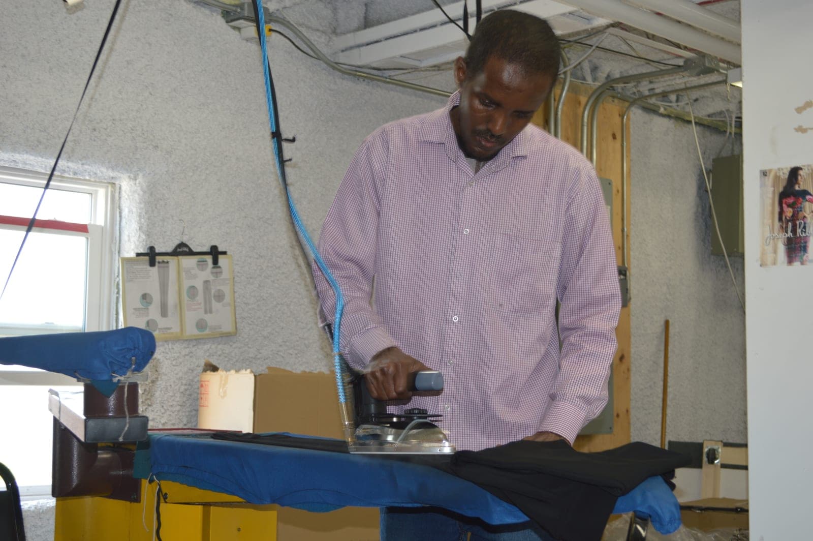 Garments pressed at the finishing station before pack-out