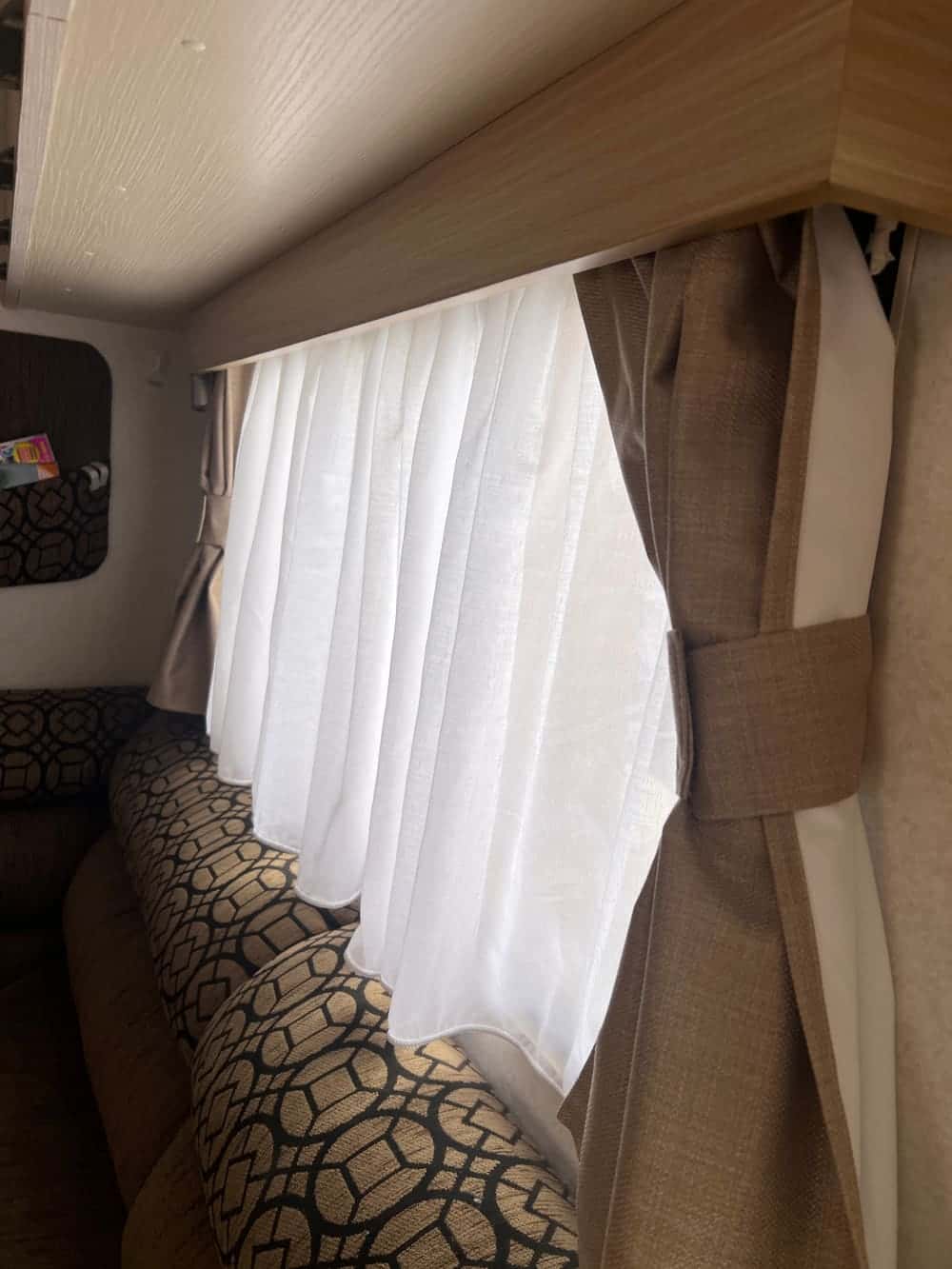 A blockout curtain fitted in a campervan window