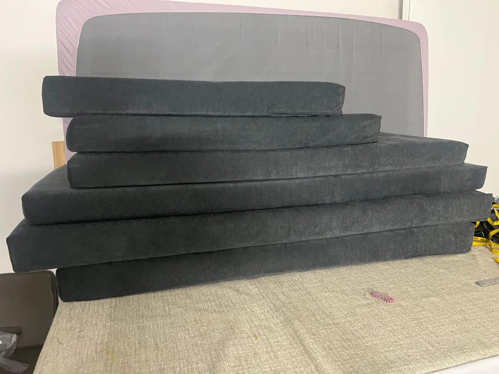 A stack of cut foam squabs ready for covering